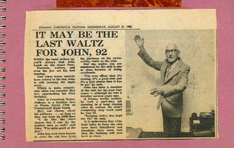 A scan of an article in the Oldham Evening Chronicle from Wednesday August 25th 1982, with a headline that reads “IT MAY BE THE LAST WALTZ FOR JOHN, 92”. There is an image of John accompanying the article, which shows him posing his arms as if dancing, wearing a suit. The clipping is backed on pink card.