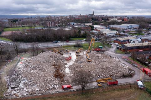 An aerial photo showing two mounds of rubble in the foreground, on the site of the towers. The landscape is clearly visible, and unobscured.